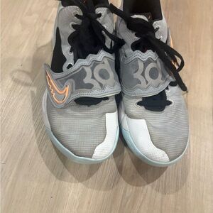 Nike Gray and Orange Athletic Shoes with Modern Design